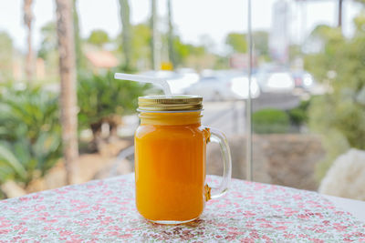 Close-up of drink in glass jar on table