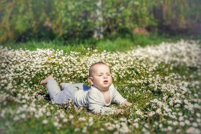 Cute girl lying down on land