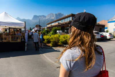 Rear view of women standing at town square