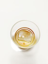 Close-up of drink in jar against white background