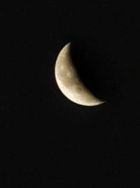 Low angle view of moon against sky at night