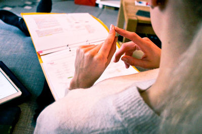 Close-up of woman holding book