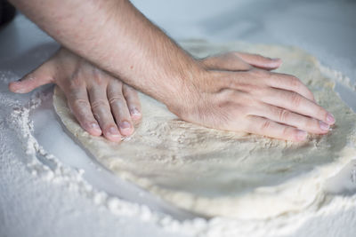 Cropped image of man washing hands