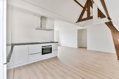 Low angle view of empty wooden floor at home