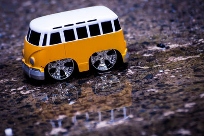 Reflection of yellow toy car