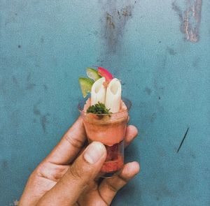 Close-up of hand holding ice cream cone