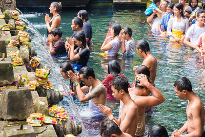 High angle view of people enjoying in water