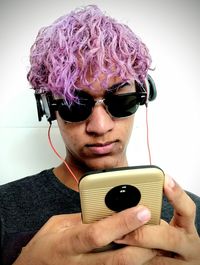 Portrait of young man using mobile phone