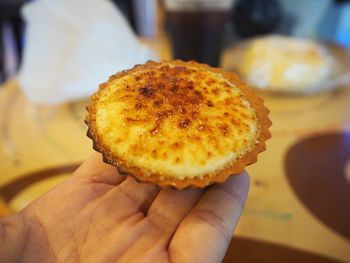 Close-up of hand holding ice cream