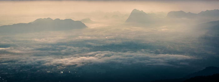 Aerial view of mountains against sky during sunset