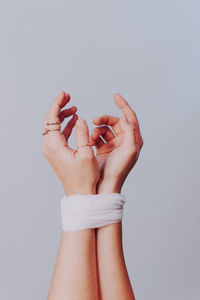 Low section of woman against white background