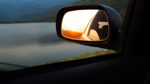 Reflection of car on side-view mirror