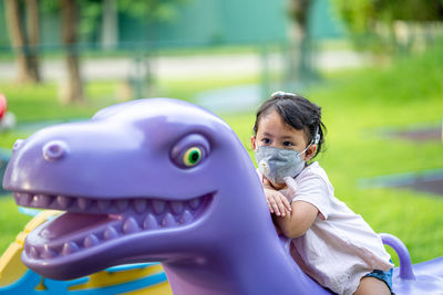 Portrait of cute boy with toy