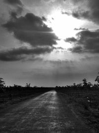 Scenic view of landscape against cloudy sky