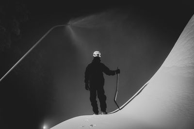 Low angle view of man holding rope