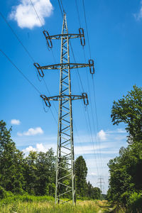 Low angle view of electricity pylon against sky