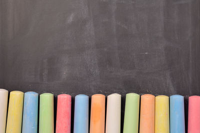 Close-up of multi colored pencils on table