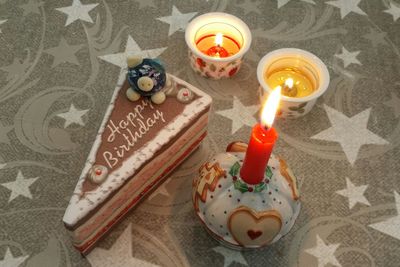 Candle lit candles on table