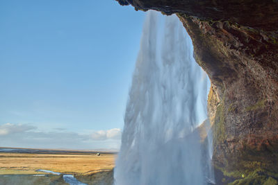 Panoramic view of sea and rocks against sky