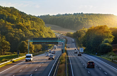 Cars on highway against sky