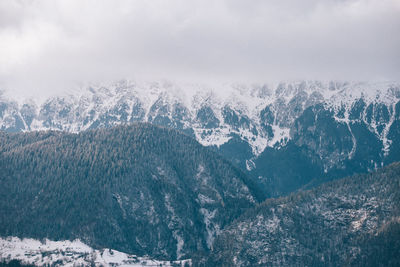 Scenic view of mountains against sky during winter