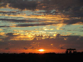 Low angle view of dramatic sky during sunset