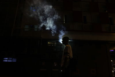 Silhouette of man working in factory