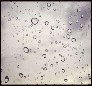 Close-up of water drops on glass