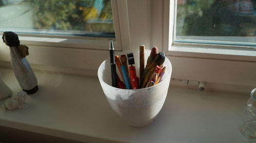 High angle view of desk organizer on window sill