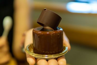 Close-up of hand holding drink