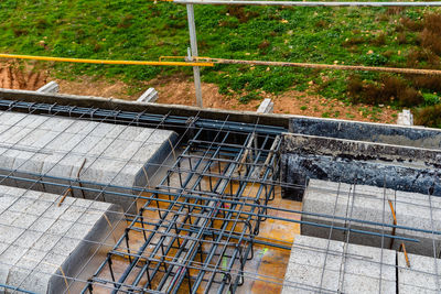 High angle view of metal grate on railroad track