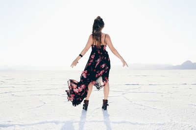 Woman standing on beach