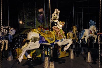 Carousel in amusement park at night