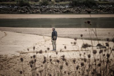 Rear view of man walking on land