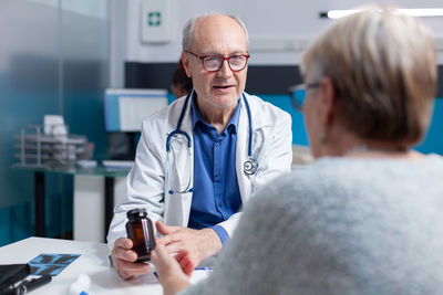 Doctor examining patient in clinic