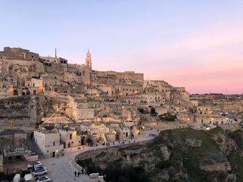 Townscape against sky during sunset