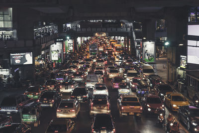 Illuminated traffic on city street at night