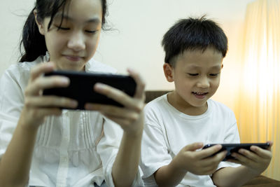 Cute boy using mobile phone