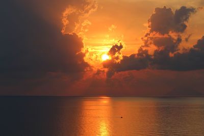 Scenic view of sea against orange sky