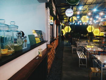 Chairs and tables in restaurant at night