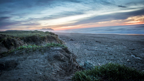 Scenic view of landscape against dramatic sky