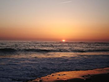 Scenic view of sea against sky during sunset