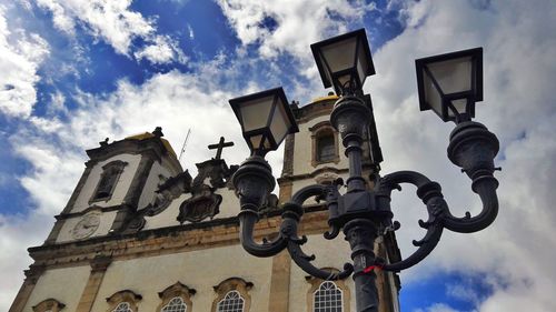 Low angle view of street light against building