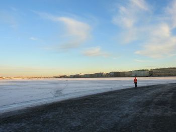 Scenic view of beach against sky during winter