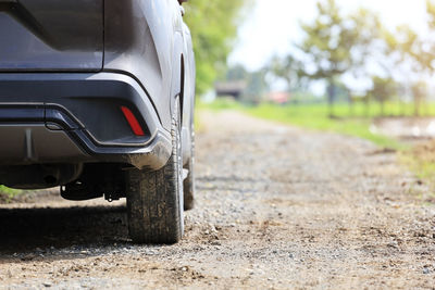 Close-up of car on road