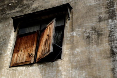 Close-up of window of abandoned building