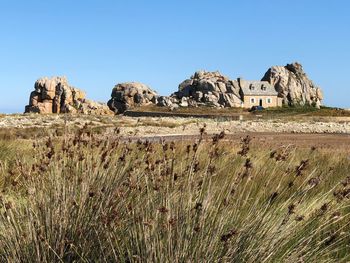 Scenic view of land against clear blue sky