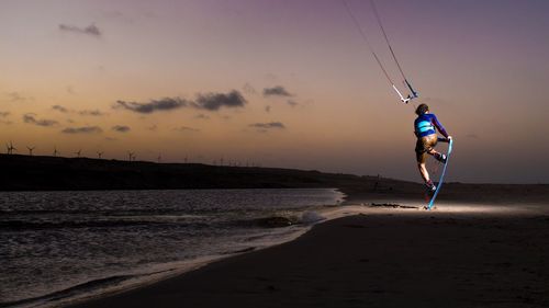 Woman jumping on beach