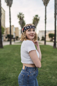 Portrait of smiling woman standing outdoors