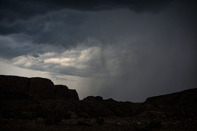 Low angle view of rock formations against sky